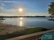 Stunning sunrise over the lake with sandy beach at 657 Portside Dr, Davidson, NC 28036