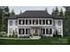 Two-story home with white siding, black shutters, and a dark roof at 0 S Potter Rd # 2A, Waxhaw, NC 28173