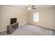 Bedroom with media stand and window blinds at 10319 Dominion Village Dr, Charlotte, NC 28269