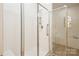 Shower with glass enclosure and tiled walls at 10934 Casetta Dr, Matthews, NC 28105