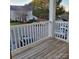 Private balcony overlooking parking lot and other buildings at 1174 Plaza Walk Dr, Charlotte, NC 28215