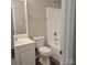 Clean bathroom with a white tub/shower, toilet, and vanity at 1174 Plaza Walk Dr, Charlotte, NC 28215