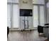 Common area features a large TV and plenty of natural light at 1174 Plaza Walk Dr, Charlotte, NC 28215