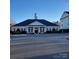 Community clubhouse with a clock tower at 1174 Plaza Walk Dr, Charlotte, NC 28215