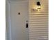White front door with black handle and address number 1174 at 1174 Plaza Walk Dr, Charlotte, NC 28215