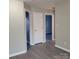 Interior hallway view with doors to other rooms at 1174 Plaza Walk Dr, Charlotte, NC 28215