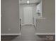 View of kitchen with stainless steel appliances and white cabinets at 1174 Plaza Walk Dr, Charlotte, NC 28215