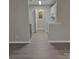 Modern kitchen with white cabinets, stainless steel appliances, and grey flooring at 1174 Plaza Walk Dr, Charlotte, NC 28215