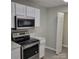Kitchen features stainless steel appliances and white cabinets at 1174 Plaza Walk Dr, Charlotte, NC 28215