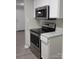 Stainless steel appliances and granite countertops in this kitchen at 1174 Plaza Walk Dr, Charlotte, NC 28215