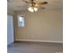 Bright living room with ceiling fan and sliding door access at 1174 Plaza Walk Dr, Charlotte, NC 28215