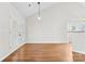 Dining area with hardwood floors and French doors leading to patio at 13217 Peacock Ln, Charlotte, NC 28215