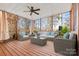 Relaxing screened porch with wooden deck and comfortable seating area at 13217 Peacock Ln, Charlotte, NC 28215