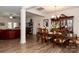 Formal dining room with dark wood table and chairs at 14425 Beatties Ford Rd, Huntersville, NC 28078