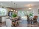 Kitchen with granite island, stainless steel appliances, and breakfast nook at 14425 Beatties Ford Rd, Huntersville, NC 28078