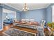 Dining room features a farmhouse table with bench seating and hardwood floors at 15816 Fairfield Dr, Matthews, NC 28104