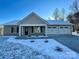 Newly built home with a two-car garage and snow-covered lawn at 190 Williamson St, Troy, NC 27371