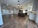 Open concept kitchen with island and stainless steel appliances at 190 Williamson St, Troy, NC 27371