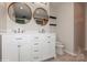 Double vanity bathroom with updated cabinets and flooring at 2015 Parkdale Ave, Gastonia, NC 28052