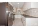 Modern kitchen with white cabinets, herringbone backsplash, and stainless steel appliances at 2015 Parkdale Ave, Gastonia, NC 28052