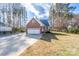 Brick ranch home with a two-car garage, and a well-maintained lawn at 2813 Alish Trl, Mount Pleasant, NC 28124