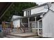 Large deck with stairs leading to a spacious backyard at 306 Mcadenville Rd, Lowell, NC 28098