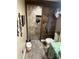 Spa-like bathroom with a walk-in shower and pebble floor at 306 Mcadenville Rd, Lowell, NC 28098