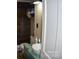 Rustic bathroom with a pedestal sink, toilet, and wood-paneled walls at 306 Mcadenville Rd, Lowell, NC 28098