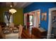 Bright dining room with hardwood floors and view of entryway at 306 Mcadenville Rd, Lowell, NC 28098