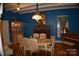 Formal dining room features hardwood floors, chandelier, and fireplace at 306 Mcadenville Rd, Lowell, NC 28098