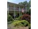 Two-story home with wrap-around porch and landscaped yard at 306 Mcadenville Rd, Lowell, NC 28098