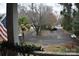 House with a circular driveway and mature trees at 306 Mcadenville Rd, Lowell, NC 28098