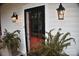 Front entrance with red door and black frame at 306 Mcadenville Rd, Lowell, NC 28098