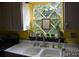 Kitchen sink with farmhouse sink and a window with diamond panes at 306 Mcadenville Rd, Lowell, NC 28098