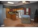 Kitchen features an island and wood cabinets at 306 Mcadenville Rd, Lowell, NC 28098
