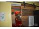 Laundry room with a red washer and dryer and a barn door at 306 Mcadenville Rd, Lowell, NC 28098