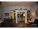 Open living room with exposed beams and view of kitchen at 306 Mcadenville Rd, Lowell, NC 28098