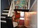 Upper view of a staircase leading to a charming entryway at 306 Mcadenville Rd, Lowell, NC 28098