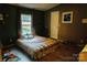 Bedroom with patterned bedding and window at 3678 Old Camden Hwy, Heath Springs, SC 29058