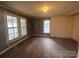 Simple bedroom with hardwood floors and large windows at 41 Aaron Ct, Taylorsville, NC 28681