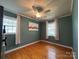 Spacious bedroom with hardwood floors and city skyline art at 4512 Gainesborough Rd, Charlotte, NC 28205