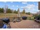 Spacious deck with built-in grill, fire pit, and ample seating at 467 Granite Lake Ct, Denver, NC 28037