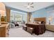 Large main bedroom with plush bedding, sitting area and lots of natural light at 467 Granite Lake Ct, Denver, NC 28037