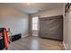 Bright bedroom with wood-look floors and window at 4805 Stowe Derby Dr, Charlotte, NC 28278