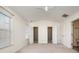 Well-lit bedroom with two closets and neutral walls at 5463 Werburgh St, Charlotte, NC 28209