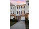 Brick front townhouse with two-car garage and balcony at 5463 Werburgh St, Charlotte, NC 28209