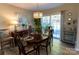 Spacious dining area with sliding glass doors leading to the patio at 702 Pierce Ave, Mount Holly, NC 28120