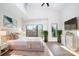 Main bedroom with high ceilings, large windows, and a neutral color palette at 819 E 36Th St, Charlotte, NC 28205