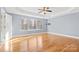 Bright bedroom with hardwood floors and large windows at 8217 Curico Ln, Charlotte, NC 28227