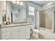 Main bathroom with granite countertop, white cabinets, and a bathtub at 823 Digby Rd, Rock Hill, SC 29730